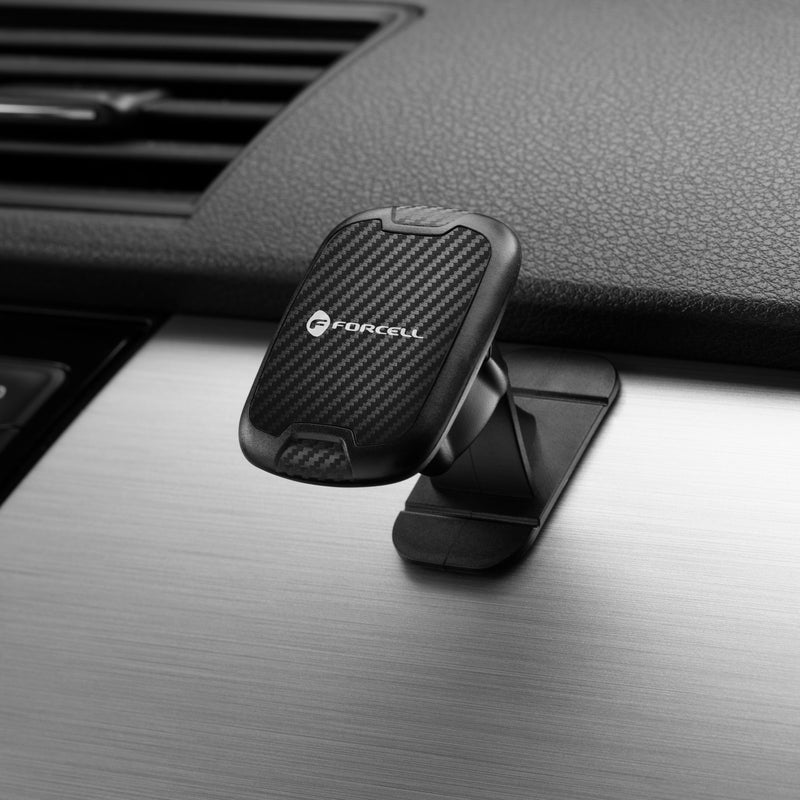 Die Carbon magnetic car holder von FORCELL sorgt mit ihrem starken Magnet für einen sicheren Halt Ihres Smartphones direkt am Armaturenbrett Ihres Fahrzeugs. Mit ihrem eleganten Carbonfaser-Design fügt sie sich nahtlos in das moderne Auto-Interieur ein.