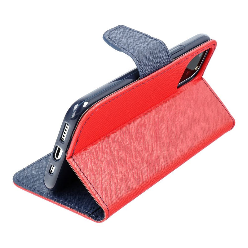 Entdecken Sie stilvollen Schutz für Ihr Samsung A35 mit unserer Fancy Book Case in auffälligem Rot und elegantem Marineblau. Bewahren Sie Ihr Smartphone sicher auf und setzen Sie ein modisches Statement, egal wohin der Tag Sie führt.