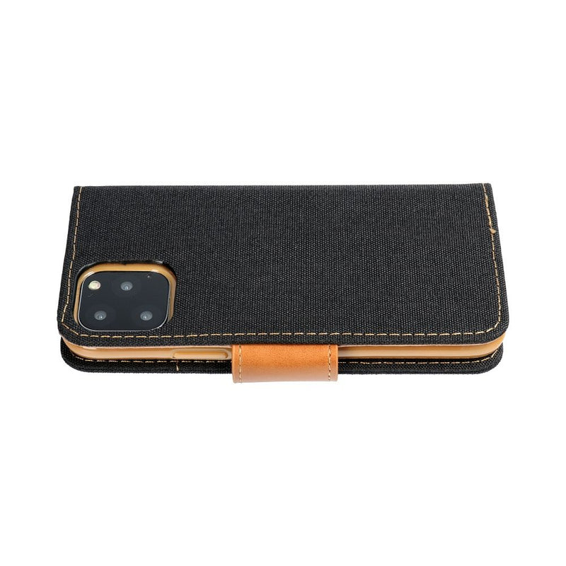 Schick und sicher: Die CANVAS Book Case Schutzhülle für das iPhone 14 in Schwarz mit edlem Lederakzent bietet stilvollen Schutz für Ihr Smartphone. Mit praktischer Aufklappfunktion und robustem Material, ideal für den Alltagsgebrauch.