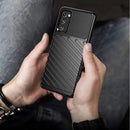Entdecken Sie robusten Schutz für Ihr Samsung Galaxy S20 FE / S20 FE 5G mit dem THUNDER Case in eleganter schwarzer Ausführung. Die strapazierfähige Schutzhülle bewahrt Ihr Smartphone vor Stößen und Kratzern und bietet dank des strukturierten Designs zusätzlichen Grip für sicheres Handling im Alltag.