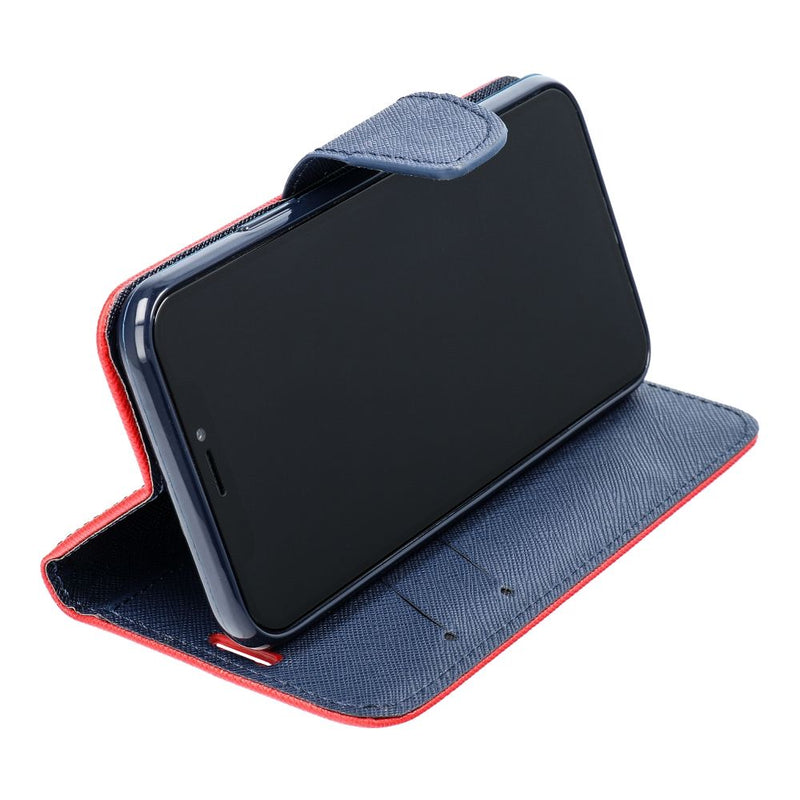 Entdecken Sie stilvollen Schutz für Ihr Samsung A35 mit unserer Fancy Book Case in auffälligem Rot und elegantem Marineblau. Bewahren Sie Ihr Smartphone sicher auf und setzen Sie ein modisches Statement, egal wohin der Tag Sie führt.